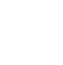 A white bag of money sitting in front of some buildings.